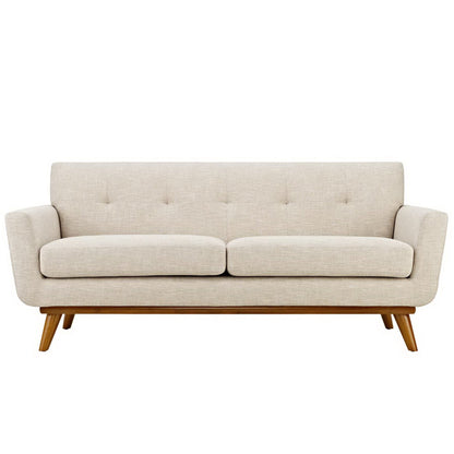 Beige mid-century fabric sofa with two seat cushions, button-tufted back, curved arms and wooden angled legs.