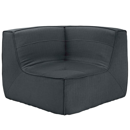 Charcoal gray upholstered fabric corner sofa with plush cushions and stitched panel details.