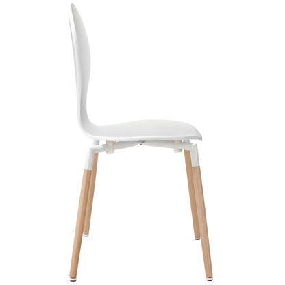 White molded dining chair with curved backrest and natural wood legs with white caps.