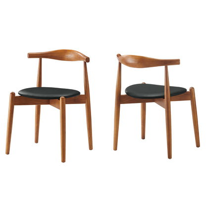 Pair of mid-century teak dining chairs with black upholstered seats, curved backrests, and tapered legs.