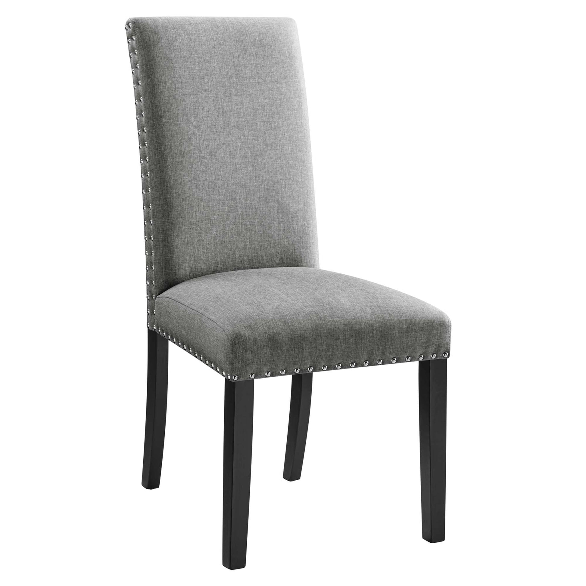 Gray fabric dining chair with tall back, nailhead trim along edges, and black wooden legs.