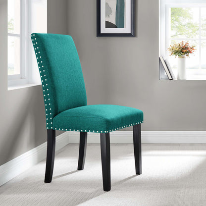 Teal upholstered dining chair with nailhead trim & black curved legs in a light gray room.