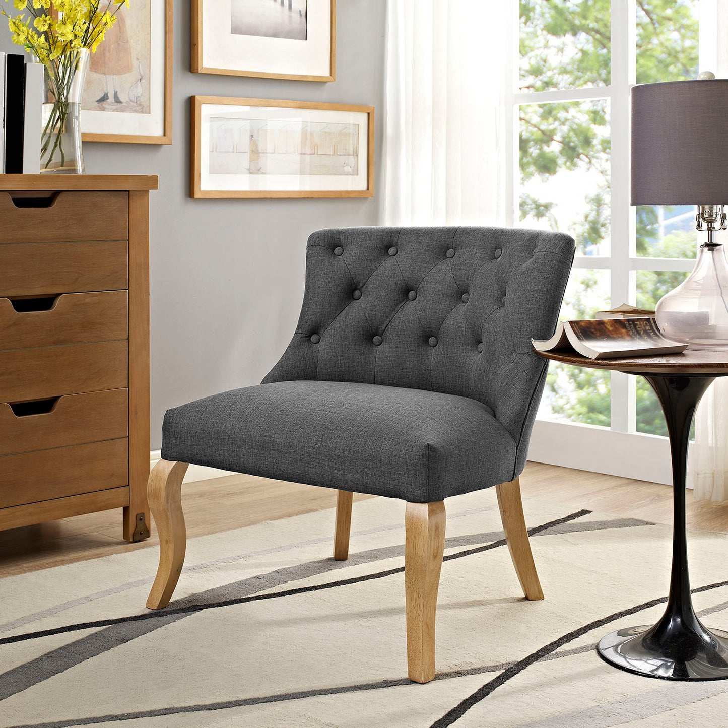 Gray upholstered fabric armchair with light wood legs for living room.