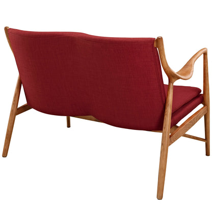 Mid-century wooden loveseat with red fabric cushions and sculpted curved arms