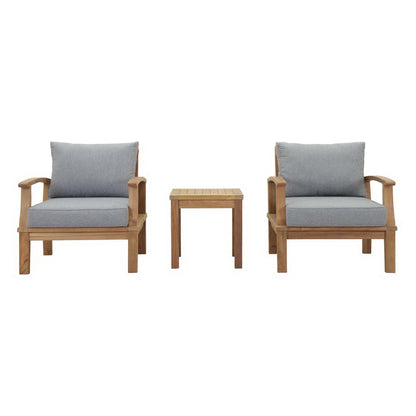 Natural wood outdoor armchairs with gray cushions and a small matching side table.