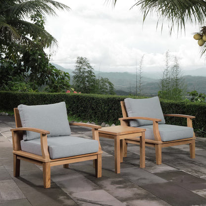 Natural wood outdoor set with two armchairs, curved arms, light gray cushions, and a matching side table.