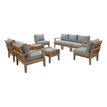 Teak outdoor patio set with gray cushions: sofa, armchairs, ottomans, and matching coffee table.
