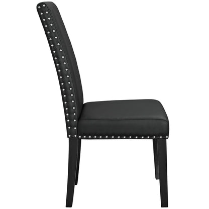 Black faux-leather dining chair with silver nailhead trim along back and seat edge; tapered legs.