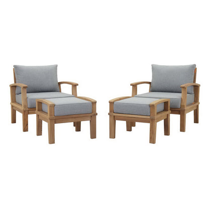 Pair of natural wood outdoor armchairs with light gray cushions and wide square arms.