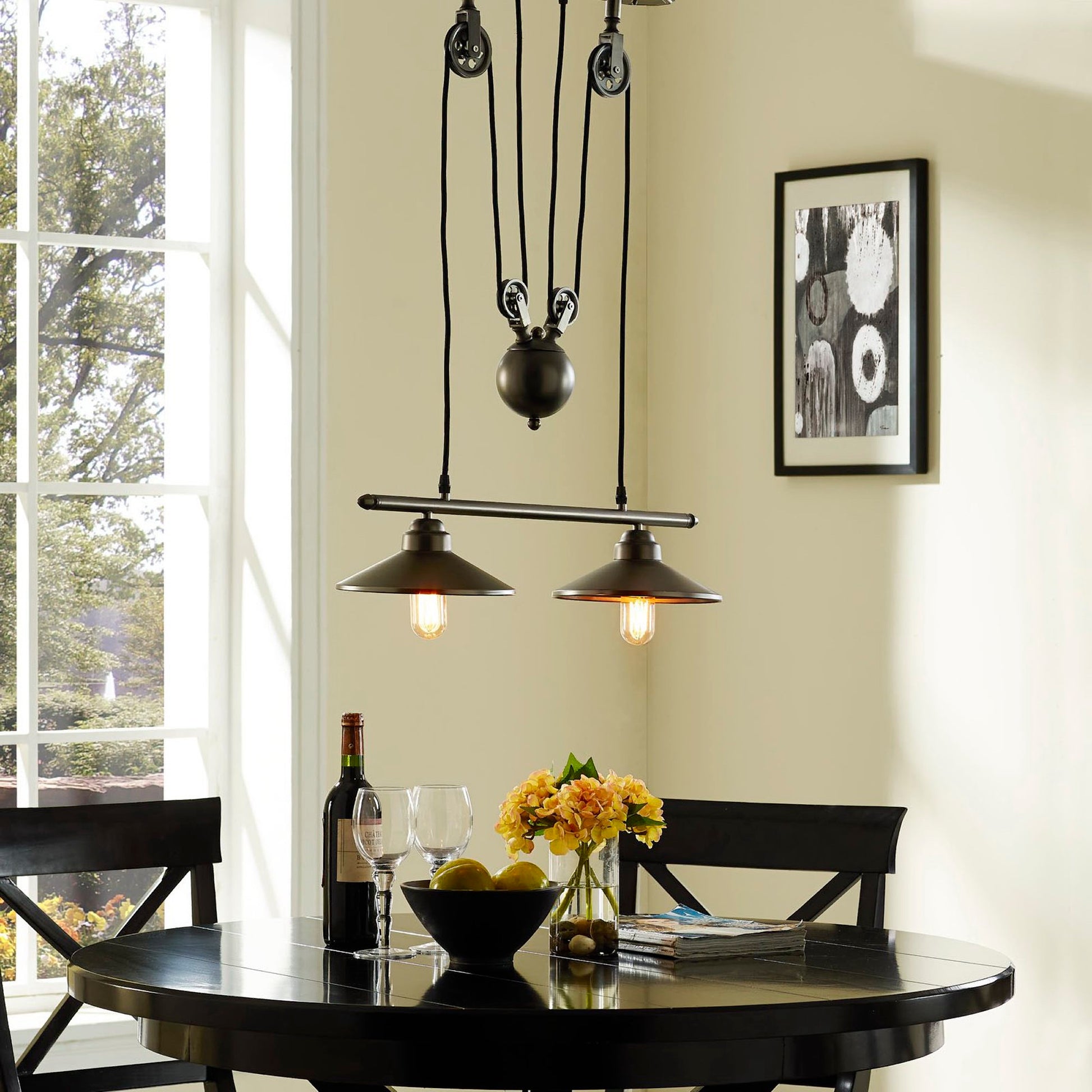 Two industrial pendant lights hanging from a silver ceiling fixture.