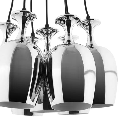 Cluster of polished chrome pendant lights with mirrored rounded shades and black cords.