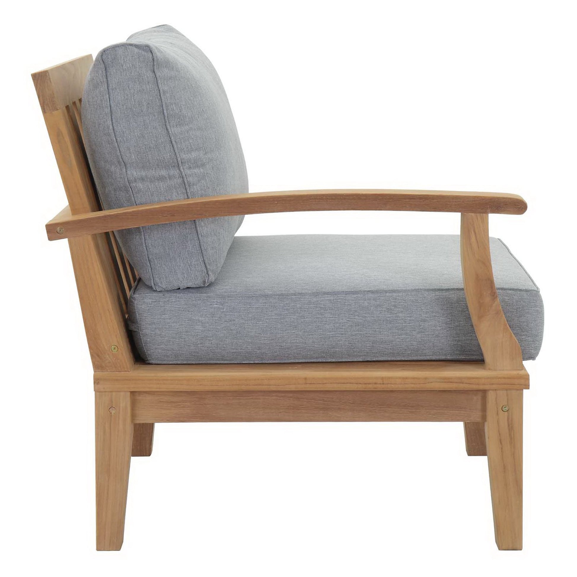 Natural wood outdoor armchair with light gray cushions, curved arms and sturdy square legs.