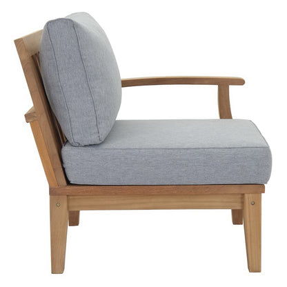 Natural wood frame lounge chair with light gray fabric cushions, mid-century style for living room seating.