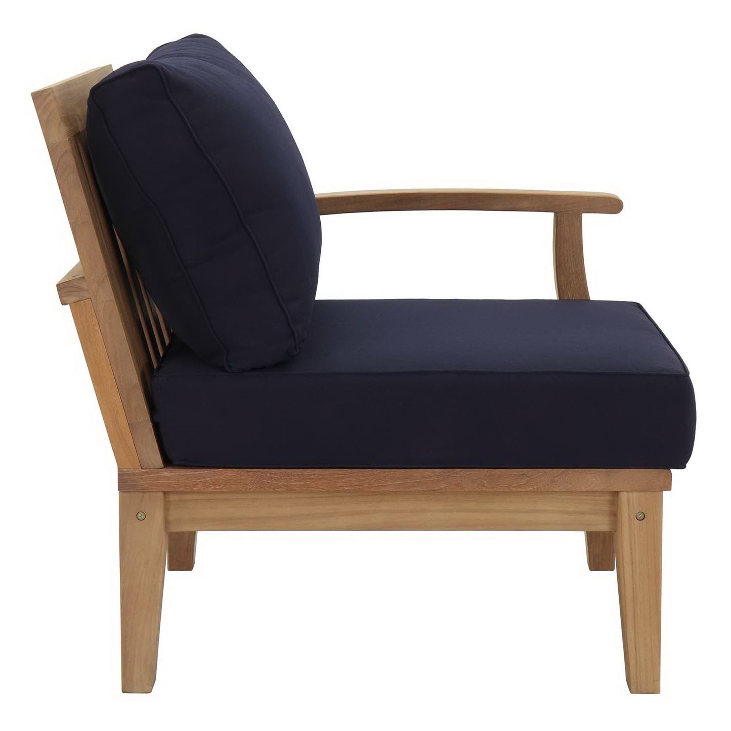 Natural wood armchair with navy cushions, slatted back, curved arms, and a mid-century style.