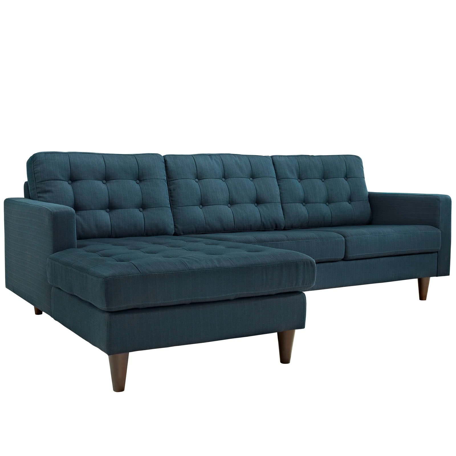 Teal-blue tufted fabric sectional sofa with chaise, mid-century wooden legs.