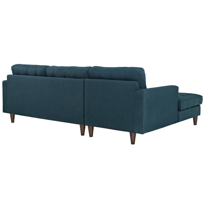 Azure blue fabric left-facing sectional with chaise, low-profile back cushions, tapered wooden legs.