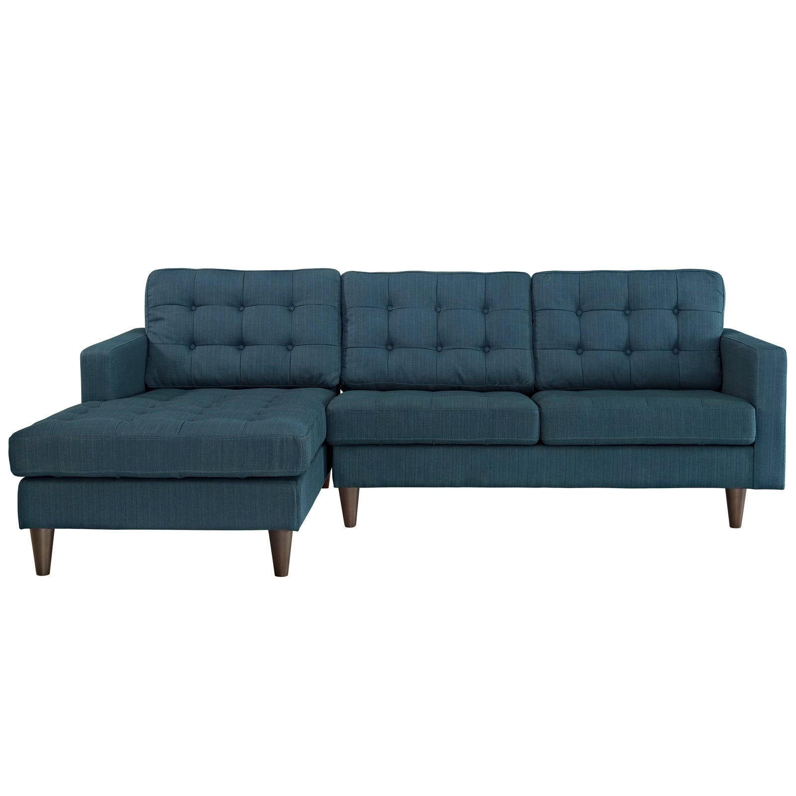 Teal-blue L-shaped sectional sofa with chaise, tufted back cushions, and tapered wooden legs.