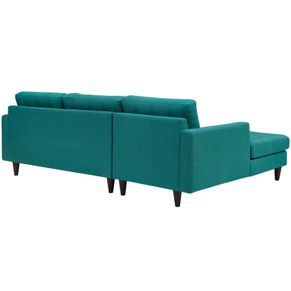 Teal fabric left-facing sectional sofa with chaise on the left, mid-century wooden legs, plush back cushions.