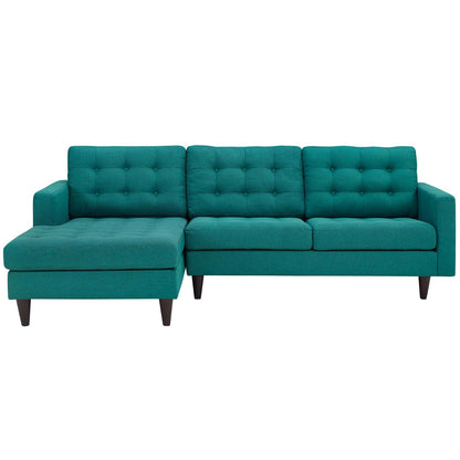 Teal L-shaped sectional sofa with left chaise, tufted back cushions and wooden legs.