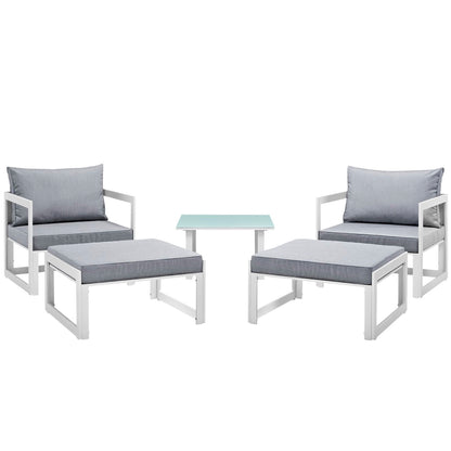 White metal outdoor patio sectional sofa set with light gray cushions and a pale blue glass-top table.