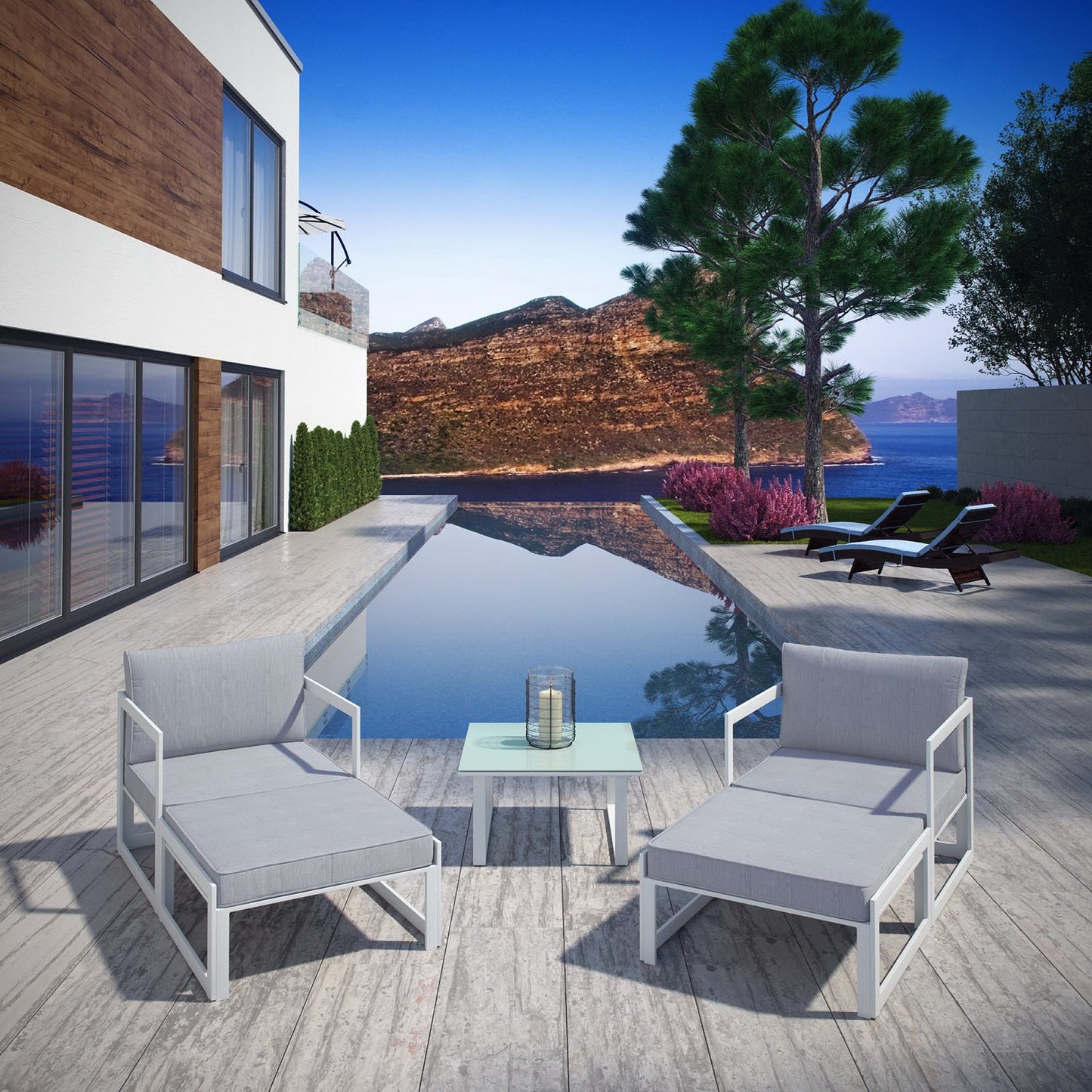Poolside outdoor lounge set with light gray cushions and white metal frames, glass-top side table on a wooden deck.