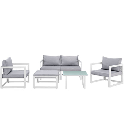 White 6-piece outdoor patio sectional sofa set with gray cushions, featuring modular seating pieces and a glass-top coffee table.