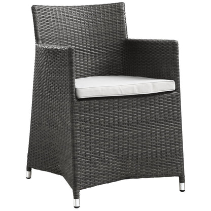 Dark brown wicker patio armchairs with white cushions and metal-tipped feet, set of 2.