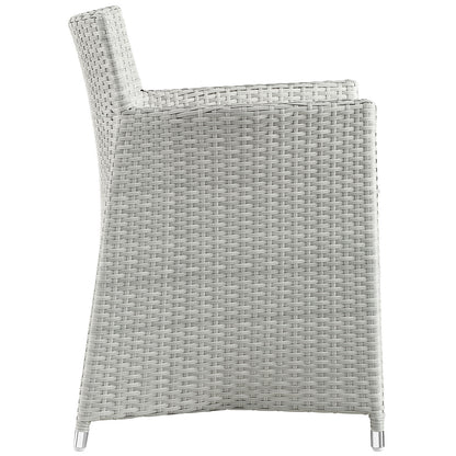 Gray and white woven rattan outdoor 7-piece dining set with metal-framed chairs for patio use