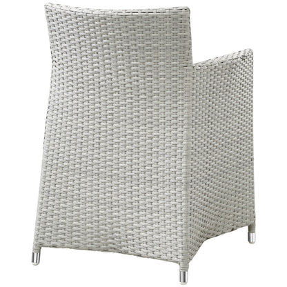 Grey and white synthetic wicker outdoor armchair with tall curved back and metal feet.