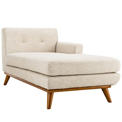 Beige fabric chaise lounge with tufted back, one armrest, long cushioned seat, mid-century wooden legs.