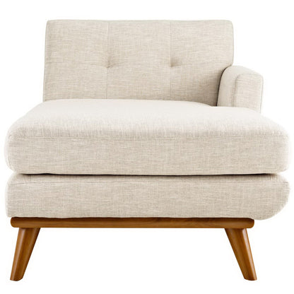 Beige fabric mid-century lounge chair with tufted back, thick seat cushion and angled wooden legs.