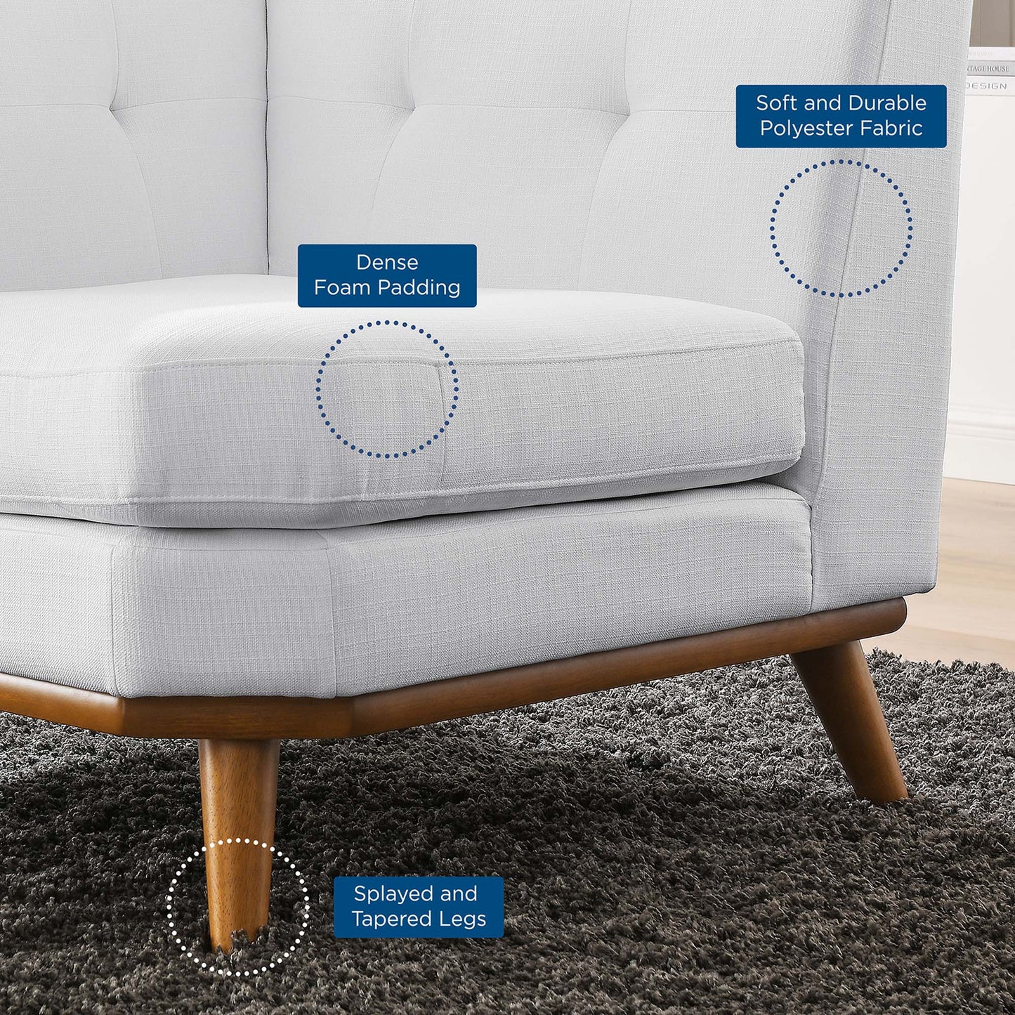 White upholstered accent chair with dense foam padding, soft polyester fabric, and splayed tapered wooden legs.