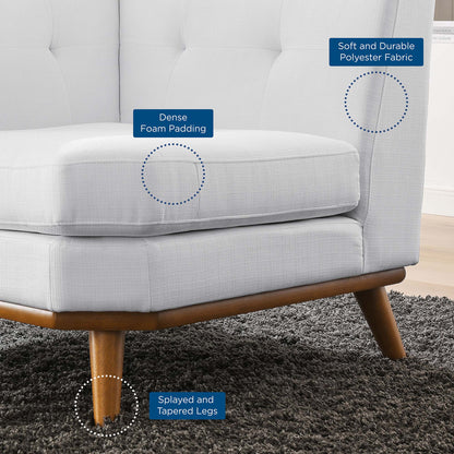 White upholstered accent chair with dense foam padding, soft polyester fabric, and splayed tapered wooden legs.