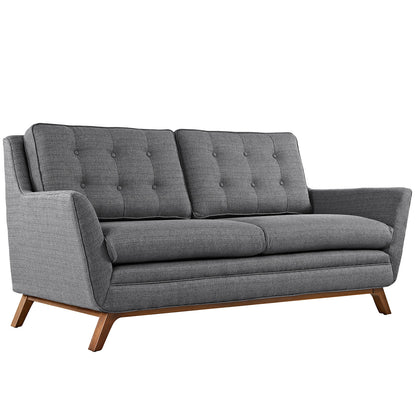 Gray mid-century modern loveseat with tufted back cushions, two-seat cushions, and angled wooden legs.