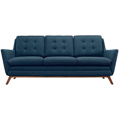 Azure blue mid-century fabric sofa with tufted back cushions and three-seat cushions, wooden angled legs.