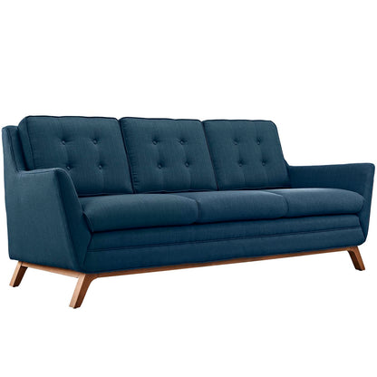 Mid-century blue fabric sofa with tufted back cushions, three-seat cushions & angled wooden legs.