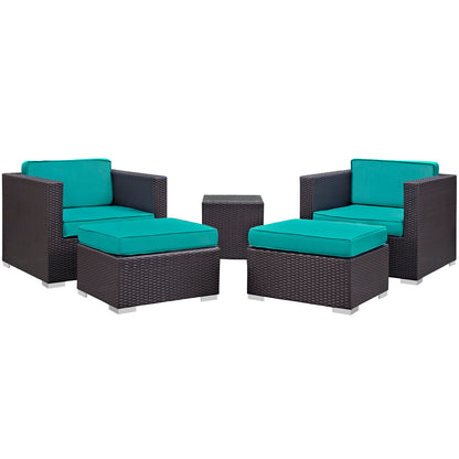 Dark brown wicker outdoor seating set with turquoise cushions: two armchairs, two ottomans, and a square table.