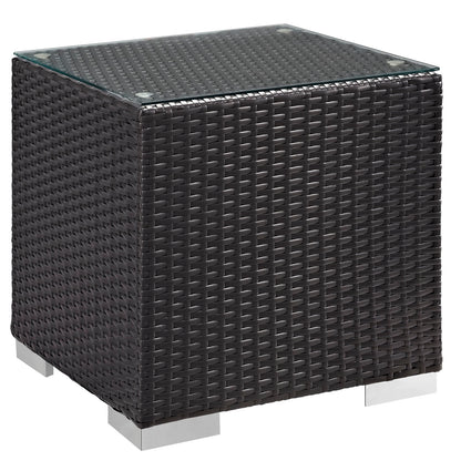 Espresso woven resin wicker cube end table with clear glass top & silver feet.
