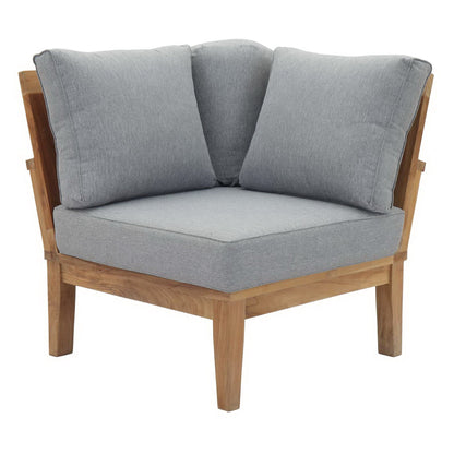 Natural wood framed accent chair with light gray seat cushion and two matching back cushions.