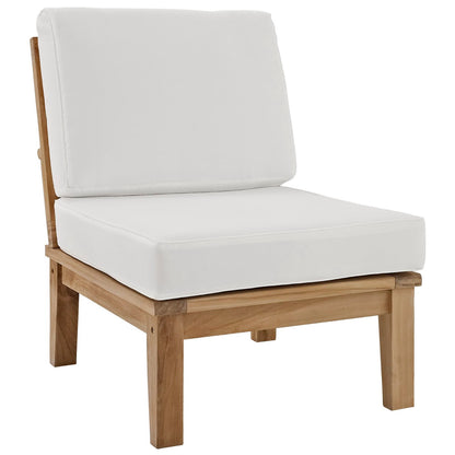 Natural wood outdoor lounge chair with thick white seat and back cushions, minimalist rustic style.