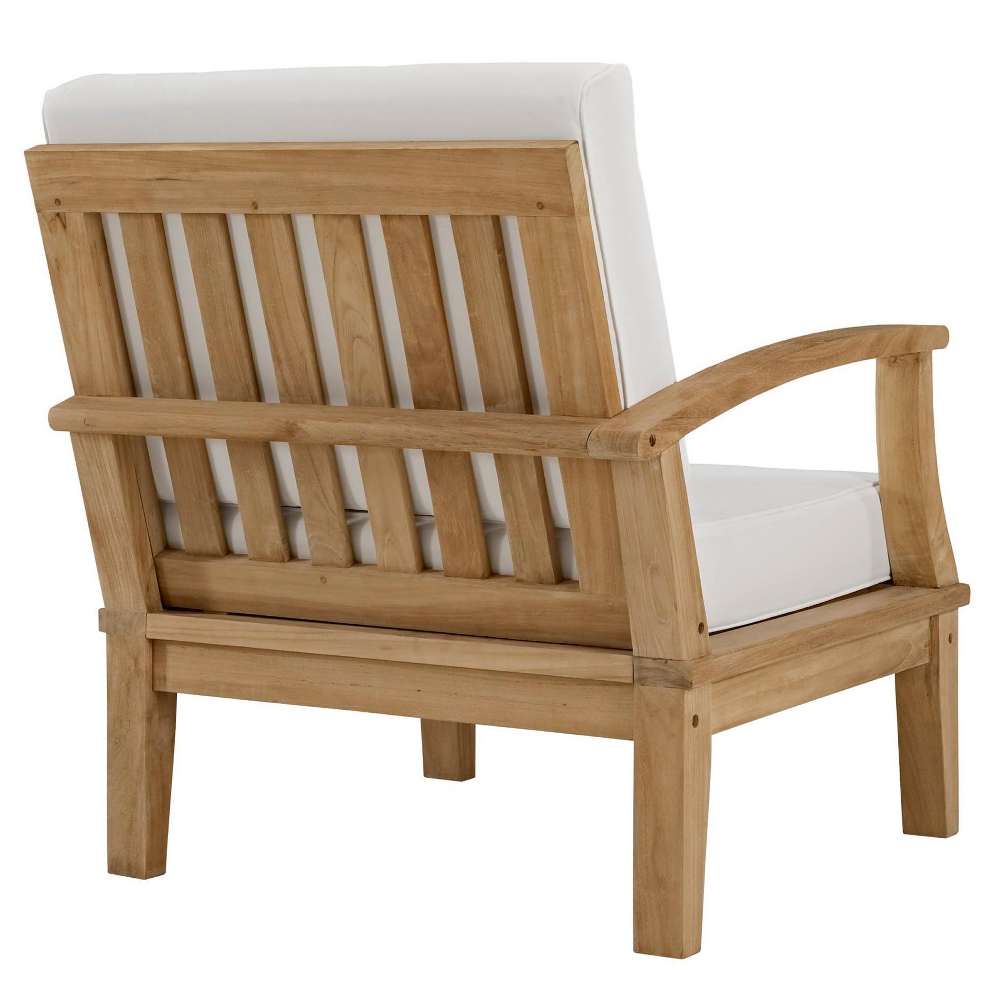 Natural wood outdoor lounge chair with white cushions, slatted back and curved armrests.