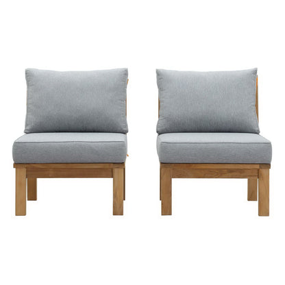 Set of two teak outdoor patio chairs with light gray cushions, minimalist outdoor seating.