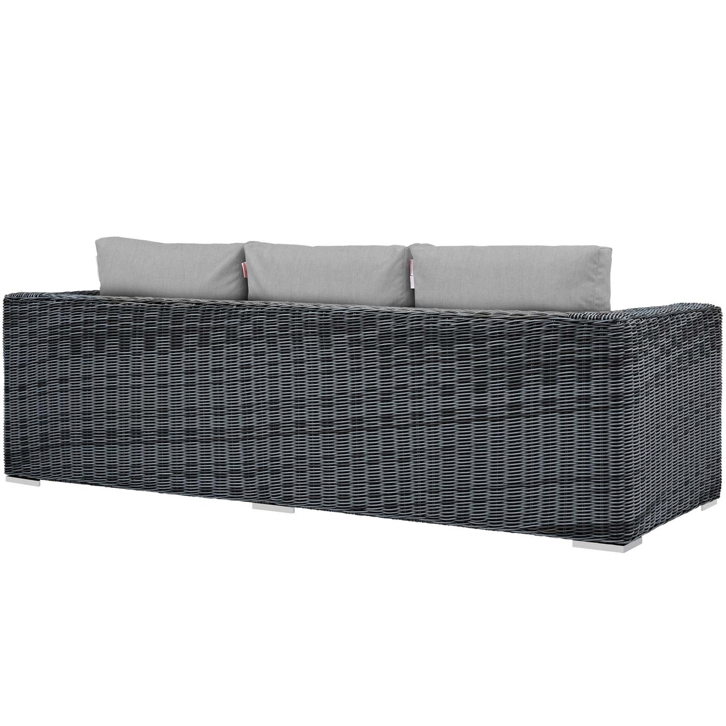 Dark gray woven rattan outdoor sofa with light gray cushions, modern low-profile patio seating.