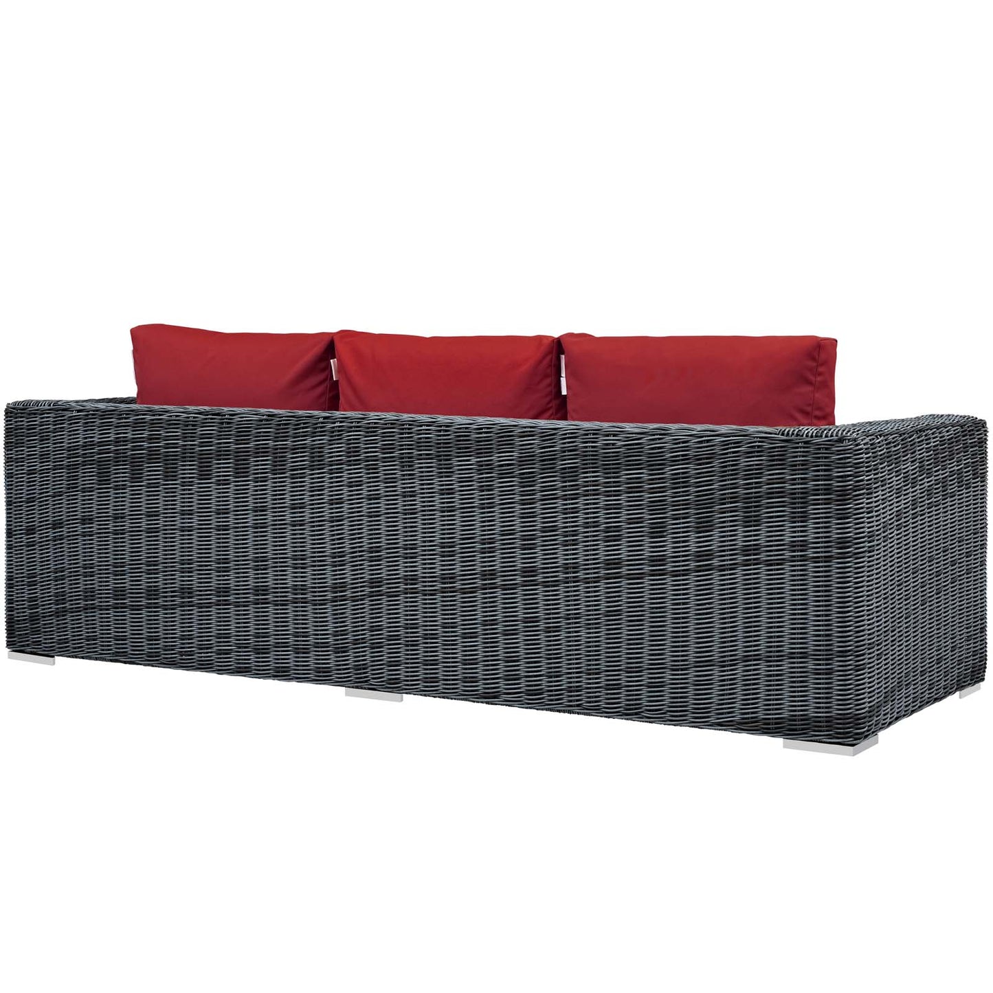 Grey wicker outdoor sofa with red cushions, modern patio seating, rectangular low-profile frame.