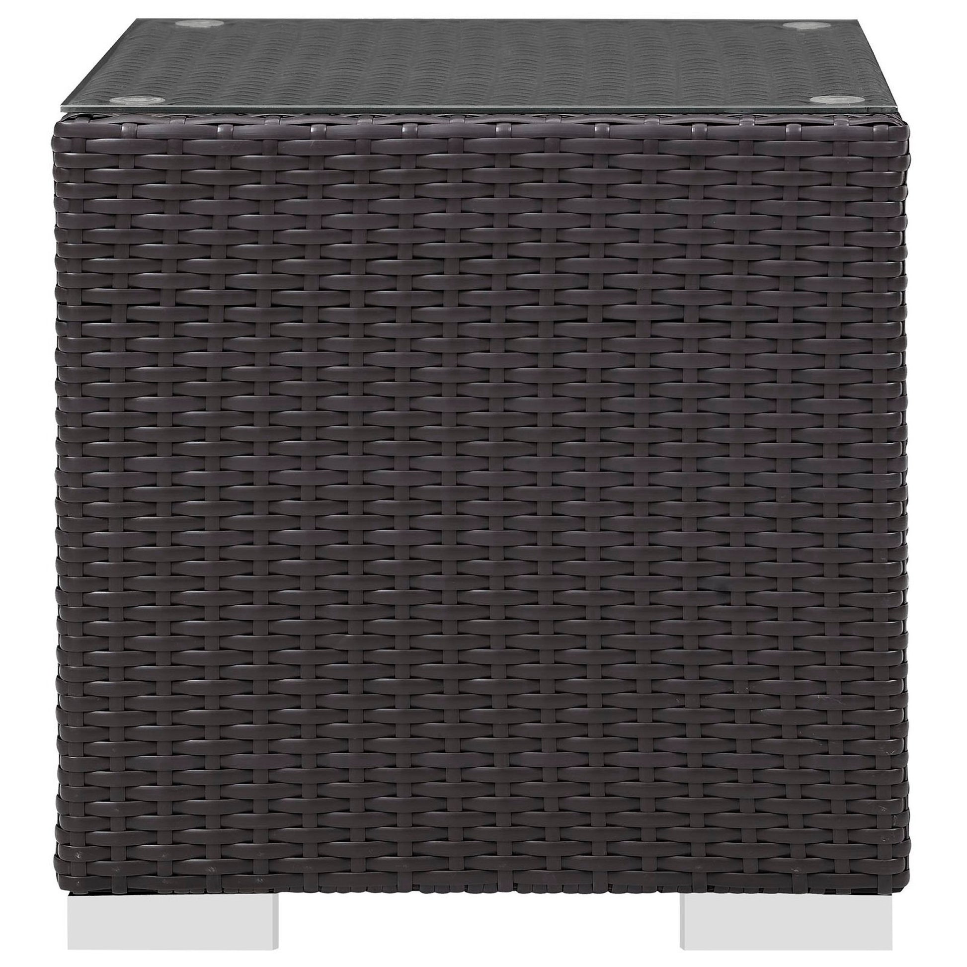 Dark brown woven rattan cube outdoor side table with glass top.