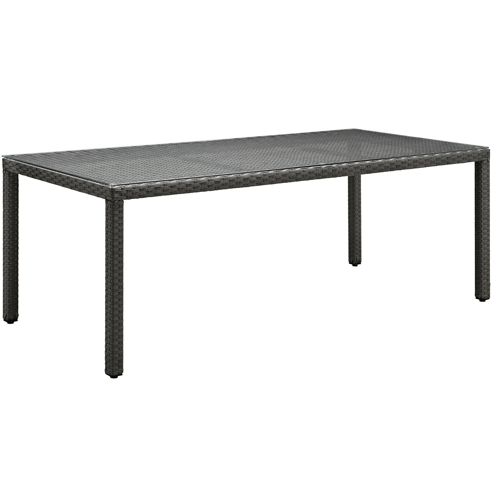 Rectangular dark brown wicker outdoor dining table with woven top and four sturdy legs.