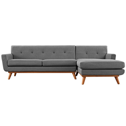 Gray fabric sectional sofa with a right-facing chaise, tufted back cushions and mid-century wooden legs