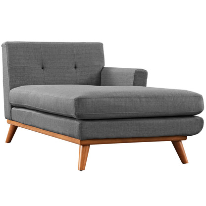 Gray fabric sectional sofa with tufted back, wide layered seat cushions, and angled wooden mid-century legs.