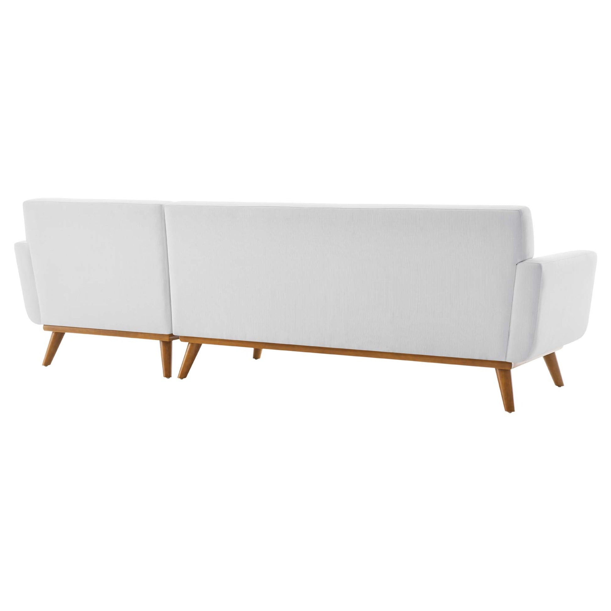 White fabric right-facing sectional sofa with wooden tapered legs and end armrests.