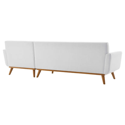 White fabric right-facing sectional sofa with wooden tapered legs and end armrests.